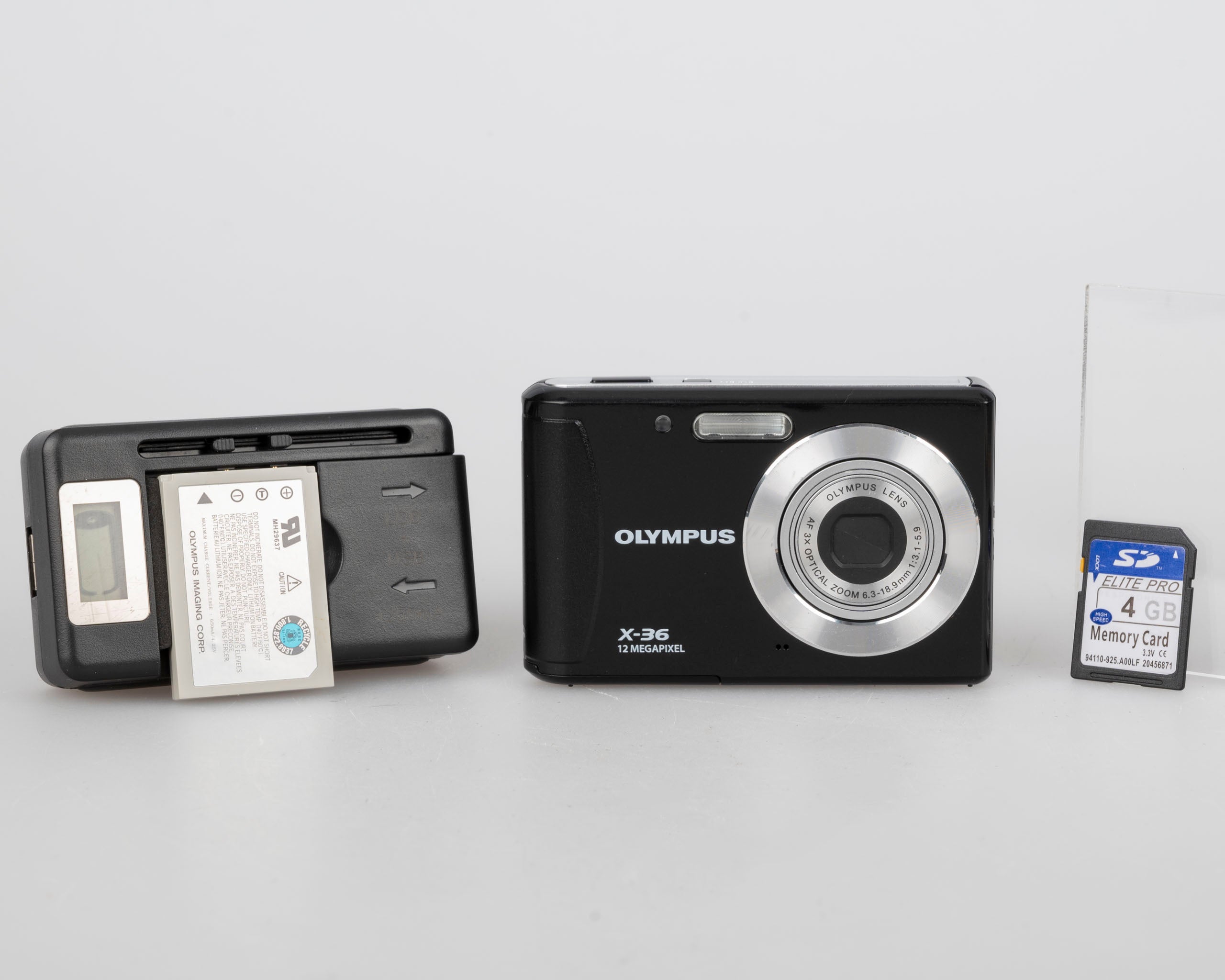 Olympus X-36 12MP CCD sensor digicam w/ charger + battery + 4GB SD