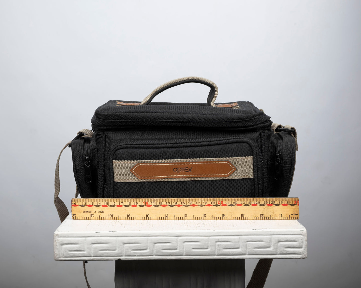 Optex mid-sized black and tan camera bag