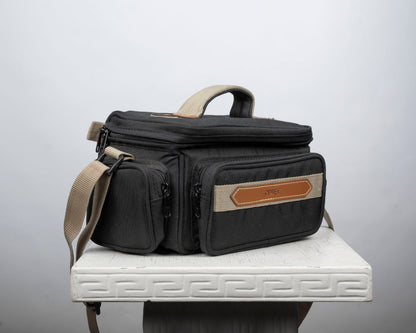 Optex mid-sized black and tan camera bag