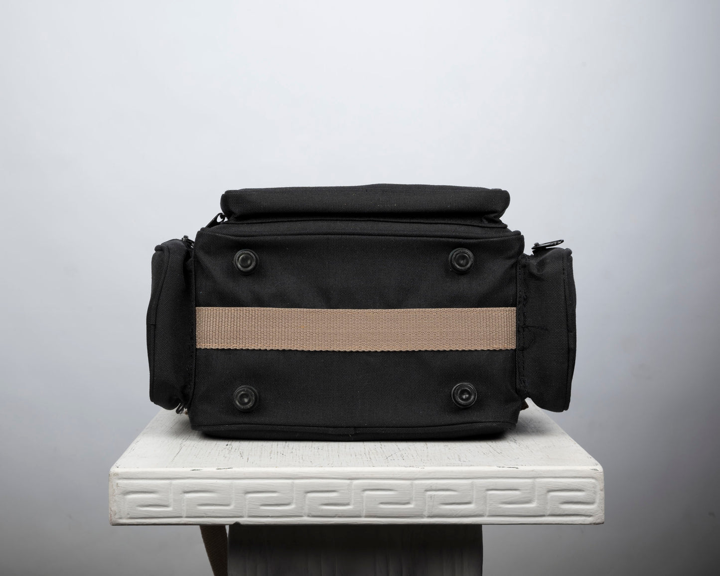 Optex mid-sized black and tan camera bag
