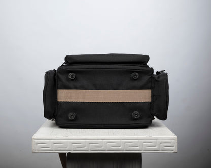 Optex mid-sized black and tan camera bag