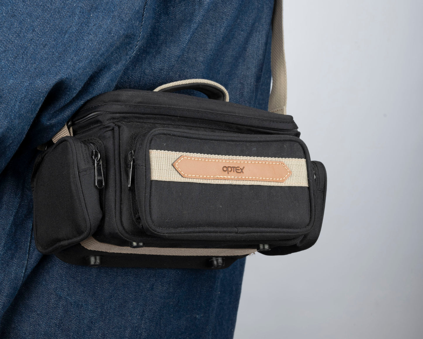Optex mid-sized black and tan camera bag