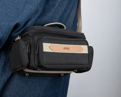 Optex mid-sized black and tan camera bag