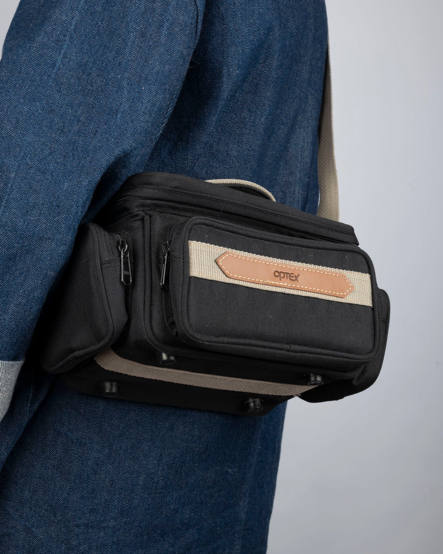Optex mid-sized black and tan camera bag