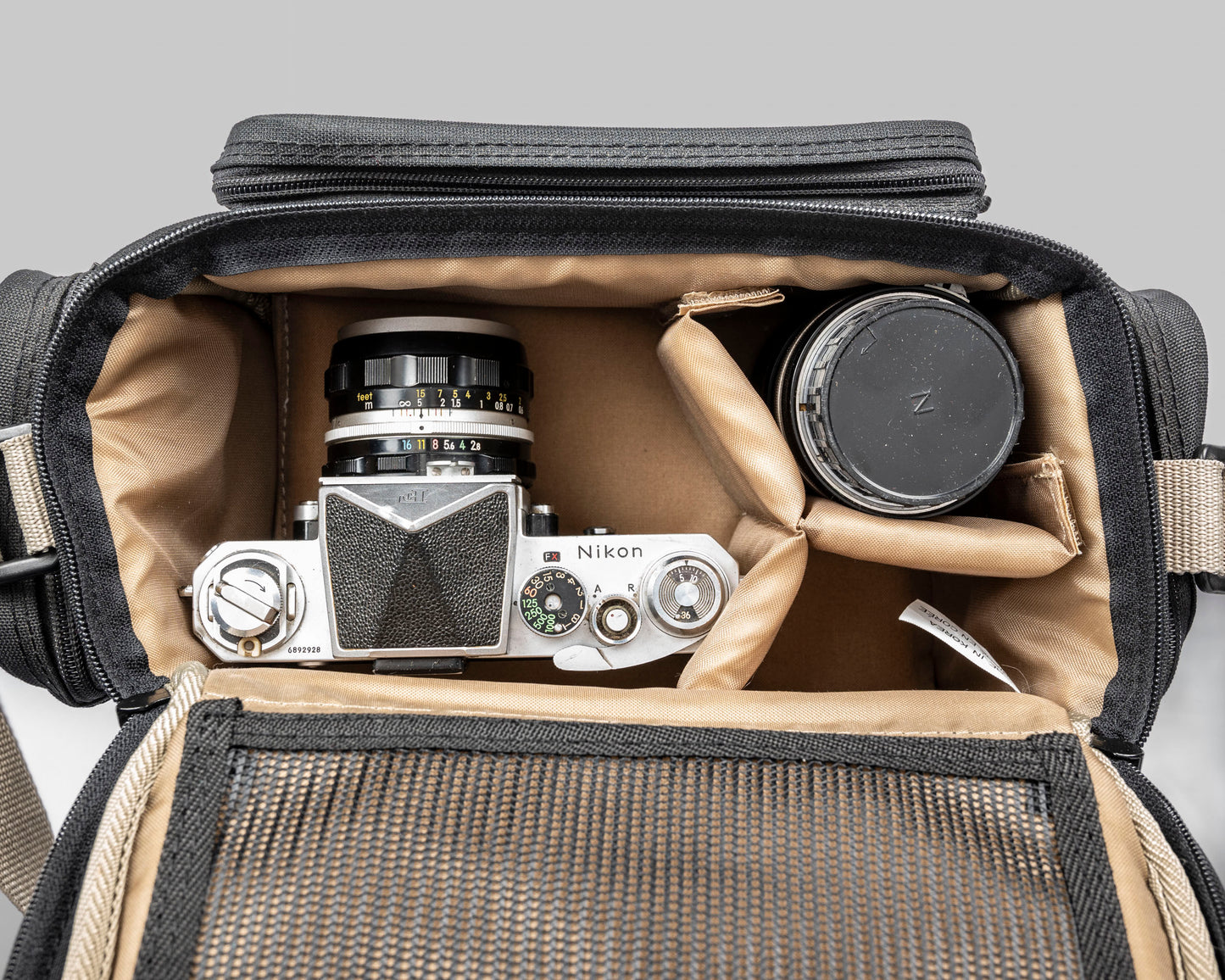 Optex mid-sized black and tan camera bag