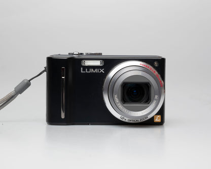 Panasonic Lumix DMC-ZS5 camera front; turned on