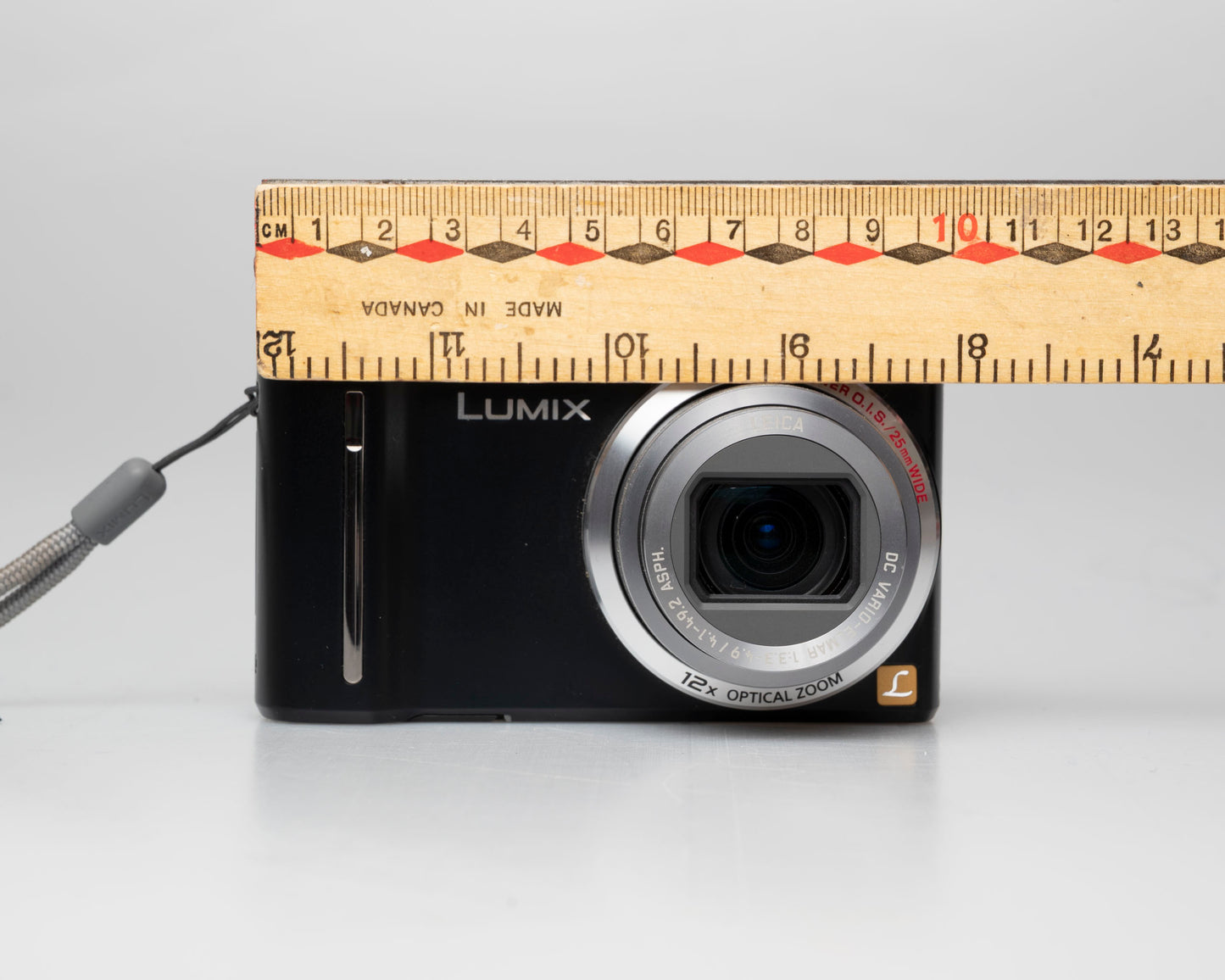 Panasonic Lumix DMC-ZS5 camera with ruler for scale