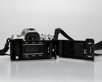 Pentax MZ-50 35mm film camera with kit zoom lens; rear view with film door open