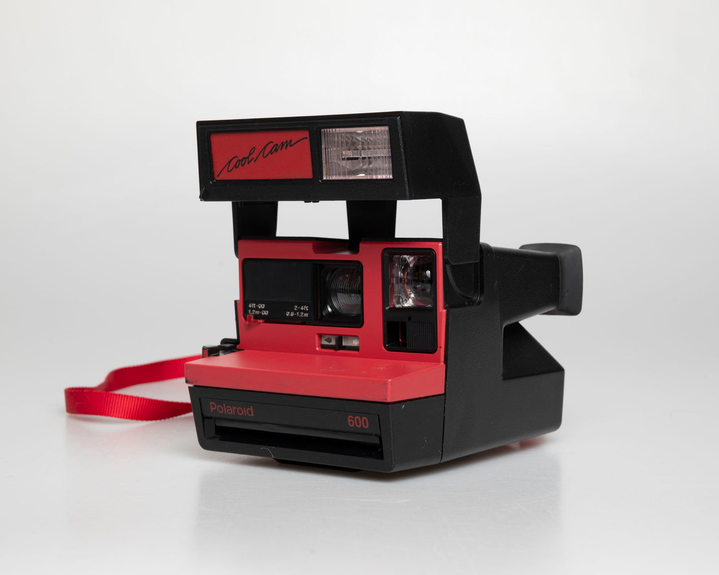Red Polaroid 600 Cool Cam instant camera (serial J2R1064VJAC)