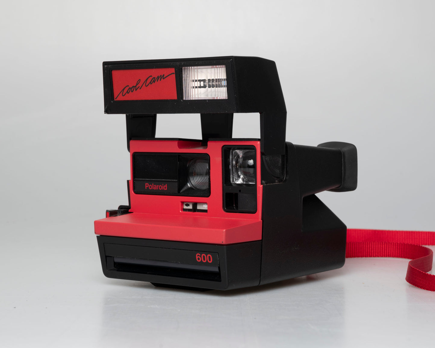 Red Polaroid 600 Cool Cam instant camera w/ matching backpack tote + manual (serial D899687VE)