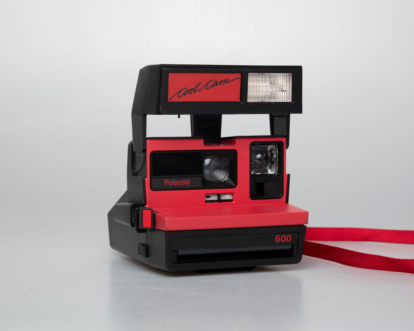 Red Polaroid 600 Cool Cam instant camera w/ matching backpack tote + manual (serial D899687VE)