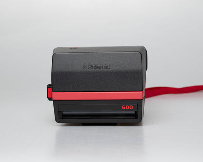 Red Polaroid 600 Cool Cam instant camera w/ matching backpack tote + manual (serial D899687VE)