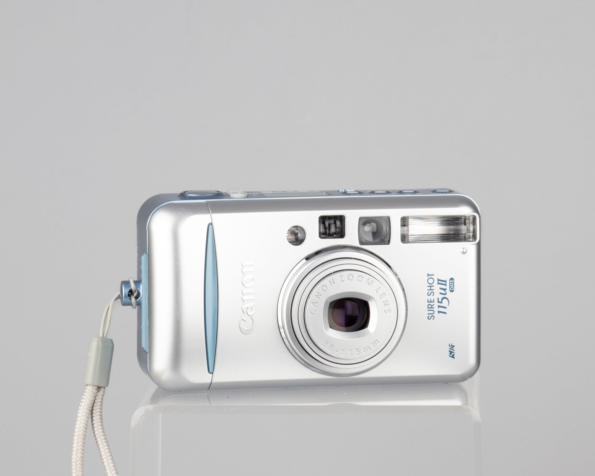 The Canon Sure Shot 115u II Date is part of the final series of Canon point-and-shoot 35mm cameras. It's an incredibly compact design.