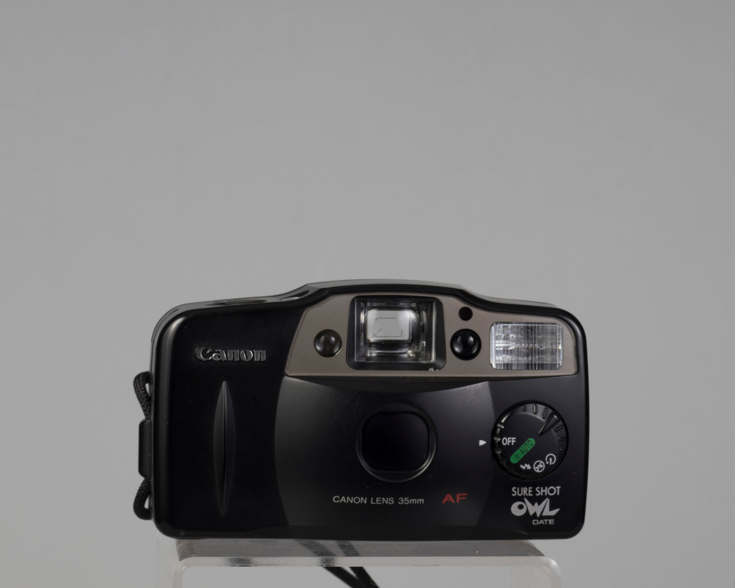 Canon Sure Shot Owl Date 35mm point-and-shoot camera (lens cap closed)