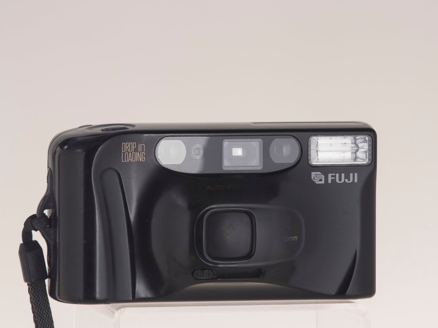 Fuji DL-80 (aka Discovery 80) 35mm point-and-shoot camera. Front view lens cap closed.