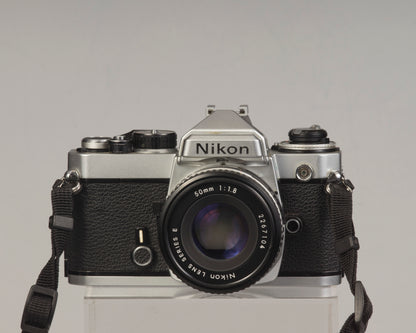 Nikon FE 35mm film SLR camera with Nikon E 50mm f1.8 lens. Available at New Wave Pool, Montreal.