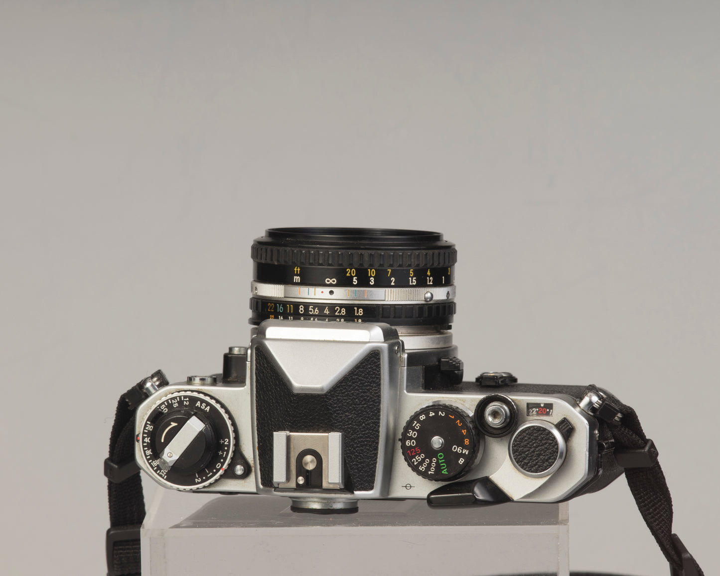 Nikon FE 35mm film SLR camera with Nikon E 50mm f1.8 lens. Available at New Wave Pool, Montreal.