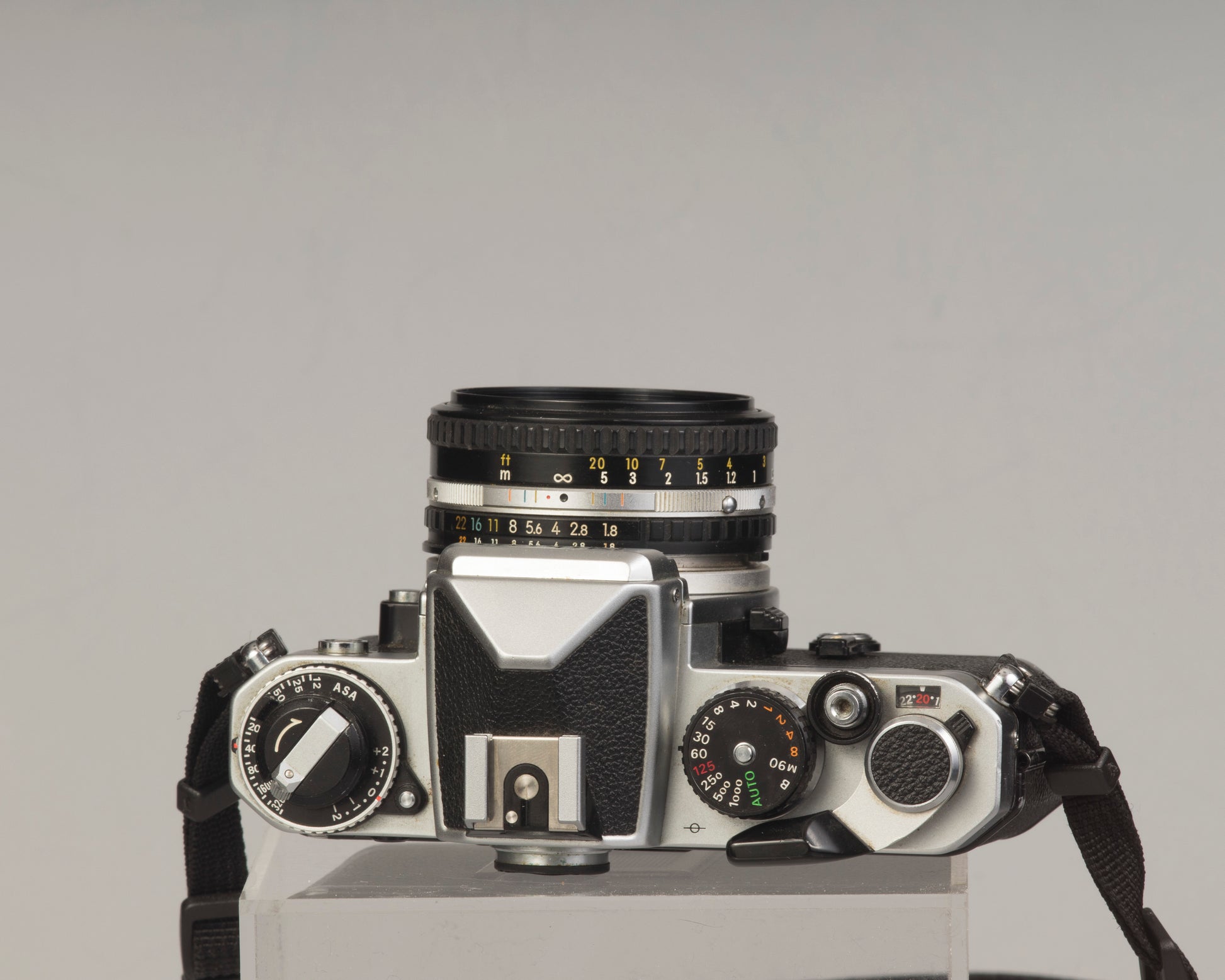 Nikon FE 35mm film SLR camera with Nikon E 50mm f1.8 lens. Available at New Wave Pool, Montreal.