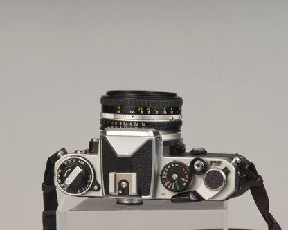 Nikon FE 35mm film SLR camera with Nikon E 50mm f1.8 lens. Available at New Wave Pool, Montreal.