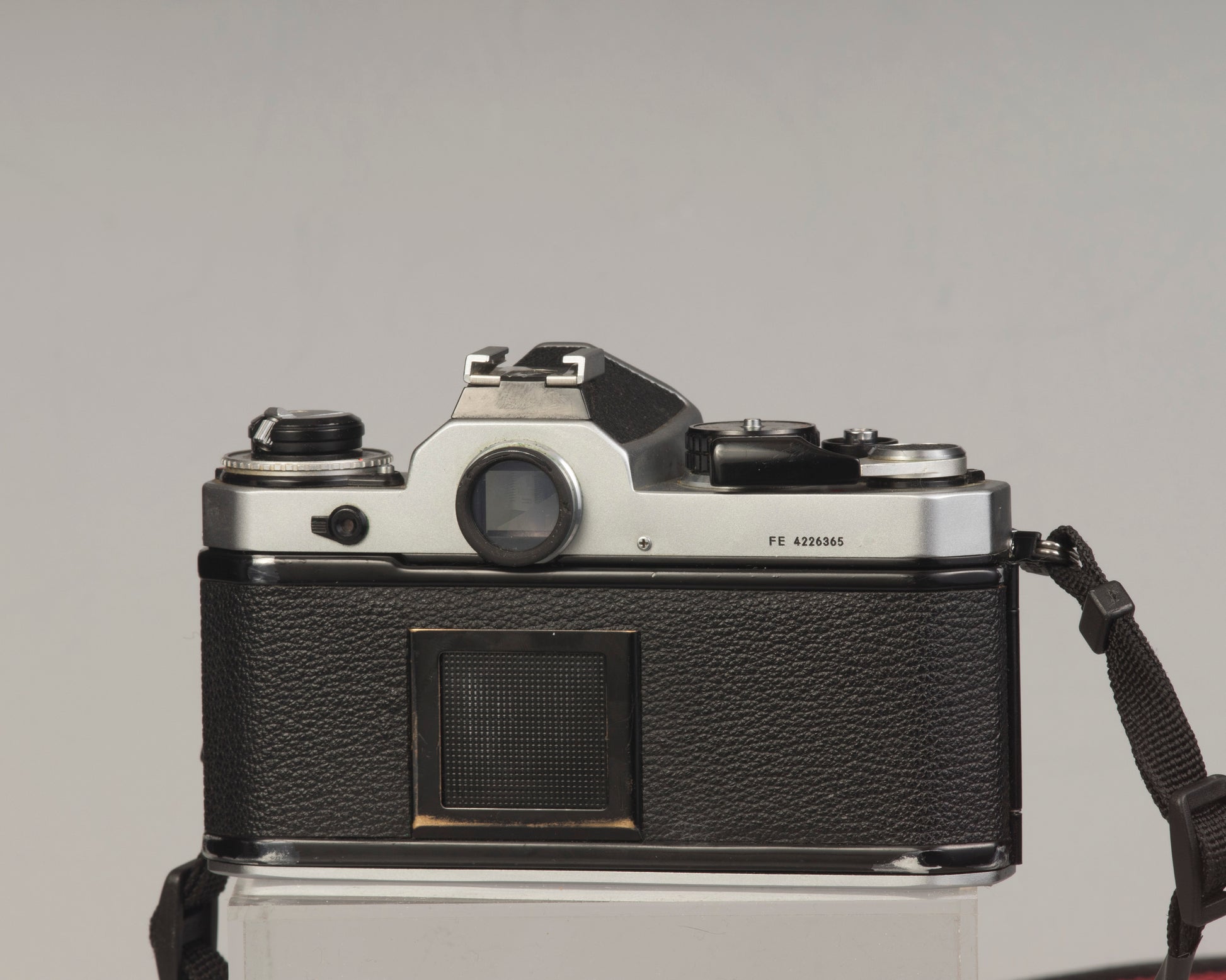 Nikon FE 35mm film SLR camera with Nikon E 50mm f1.8 lens. Available at New Wave Pool, Montreal.
