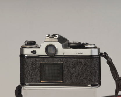 Nikon FE 35mm film SLR camera with Nikon E 50mm f1.8 lens. Available at New Wave Pool, Montreal.