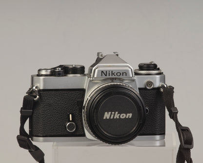Nikon FE 35mm film SLR camera with Nikon E 50mm f1.8 lens. Available at New Wave Pool, Montreal.