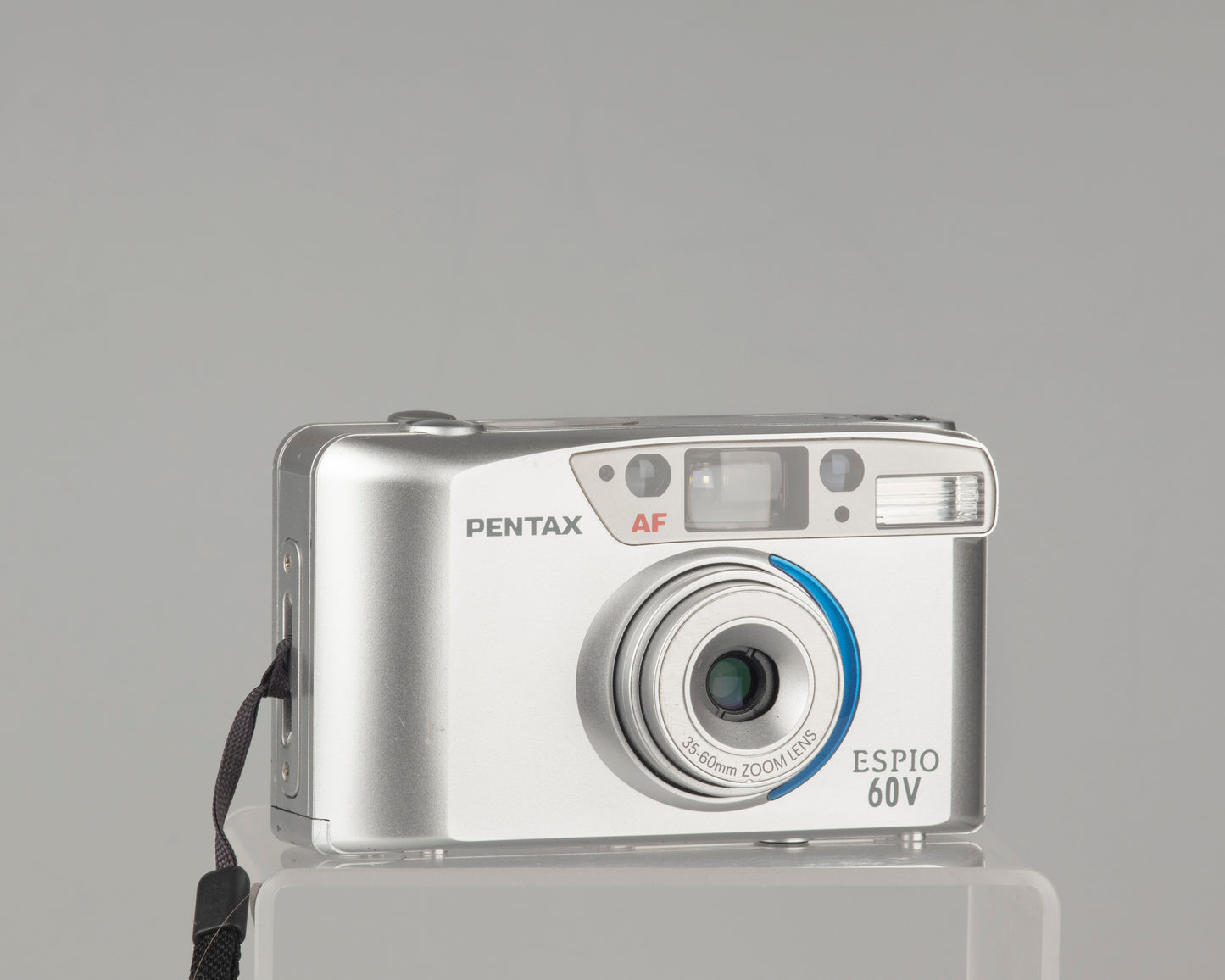 The Pentax Espio 60V is a compact 35mm film camera for 2003. 