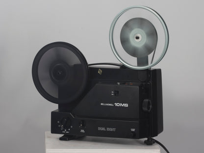 Bell and Howell 10MS dual 8mm & Super 8 projector. Shown with takeup reel. Shown operating.