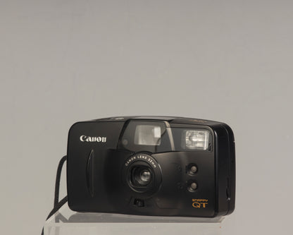 The Canon Snappy QT is a 35mm film point-and-shoot camera featuring a 32mm lens and an unusually large and bright viewfinder.