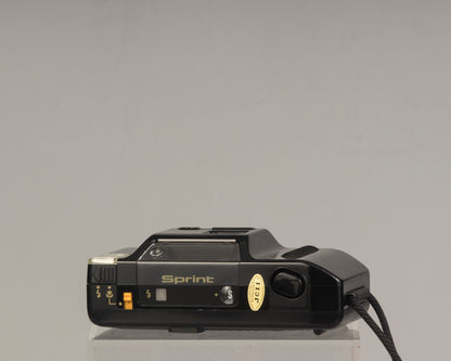 The Canon Sprint is an auto focus 35mm film point-and-shoot camera featuring a fixed 35mm f3.5 lens