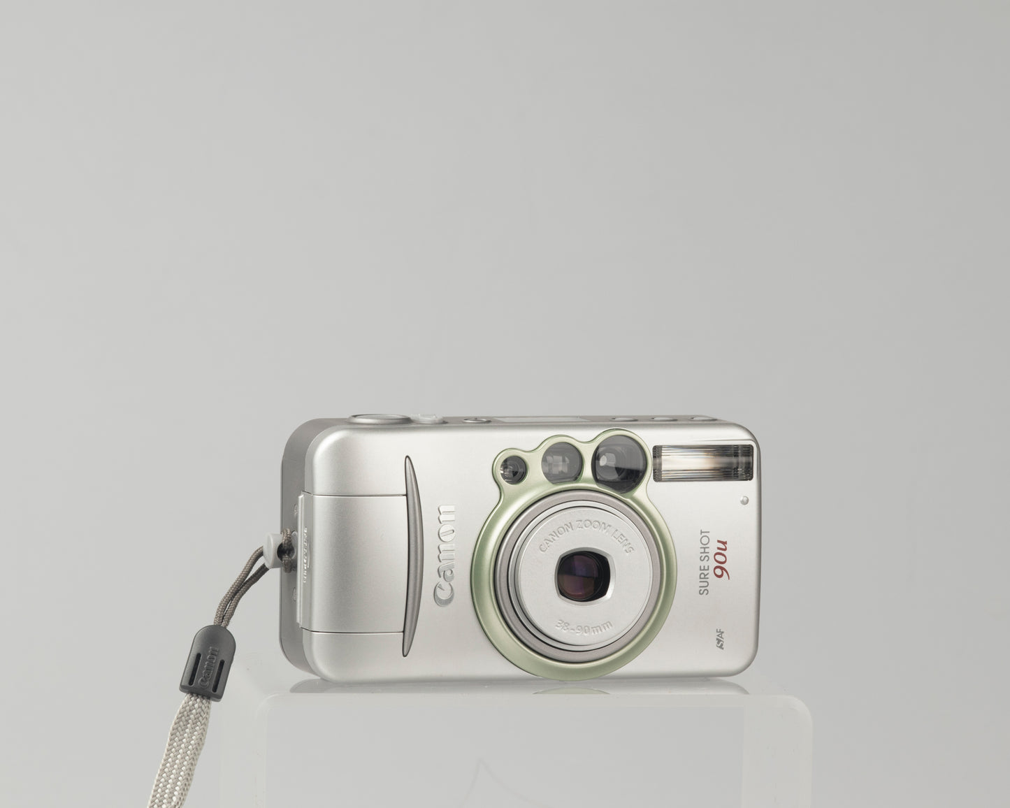 The ultra compact Canon Sure 90u (called the Prima 90u in some countries) is a very capable 35mm point-and-shoot from the early aughts.