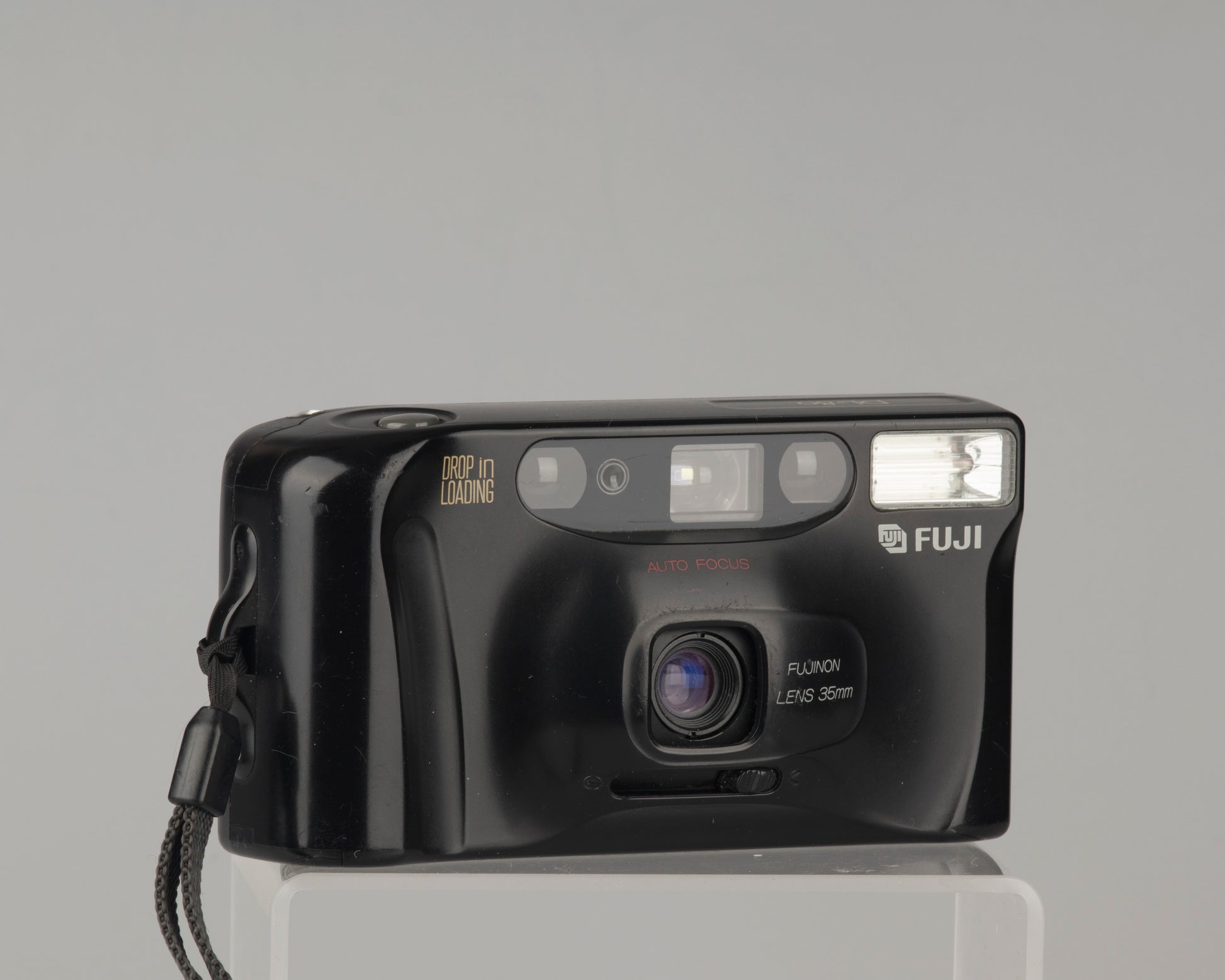 The Fujifilm DL-80 is an auto-focus compact film camera with a fixed 35mm lens