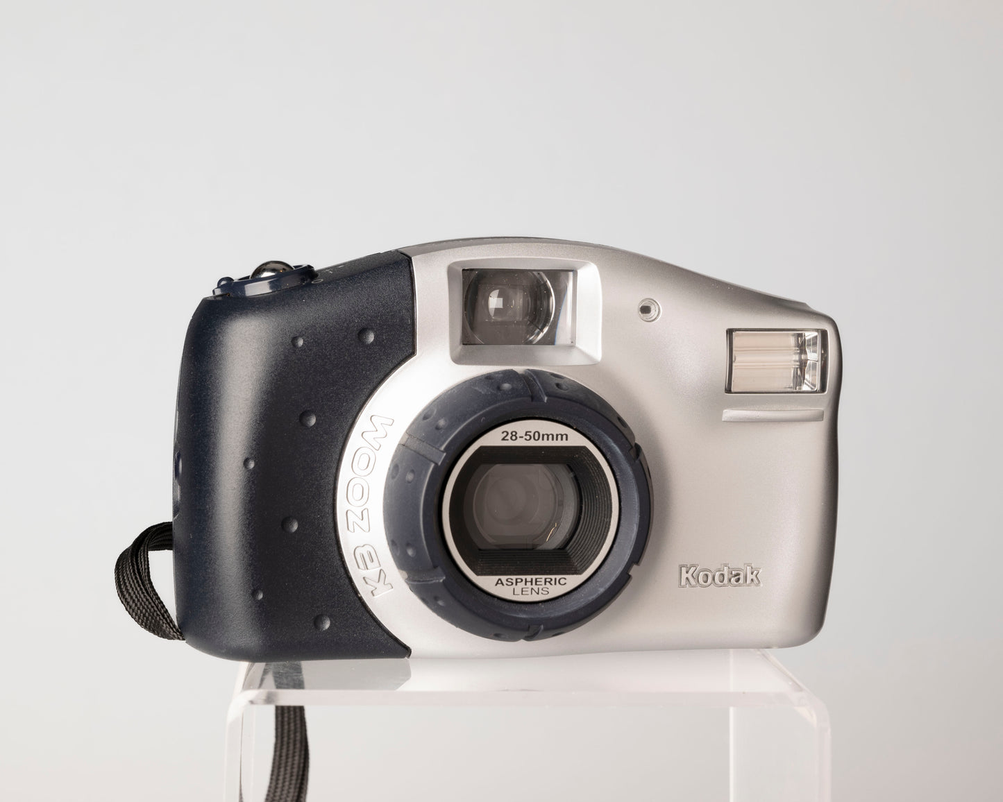 The Kodak KB Zoom is a simple point-and-shoot from the early aughts that features an atypical fixed focus zoom lens. 