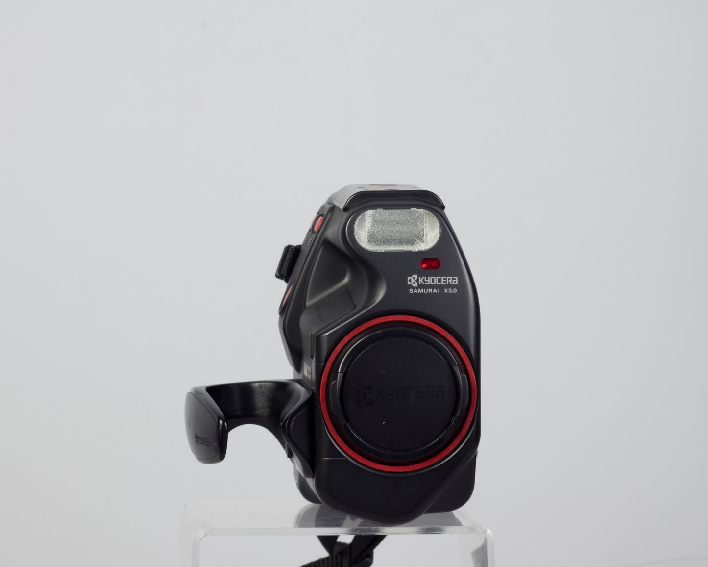 The Kyocera (Yashica) Samurai X3.0 half-frame 35mm SLR (shown with lens cap)