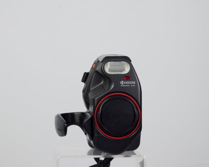 The Kyocera (Yashica) Samurai X3.0 half-frame 35mm SLR (shown with lens cap)
