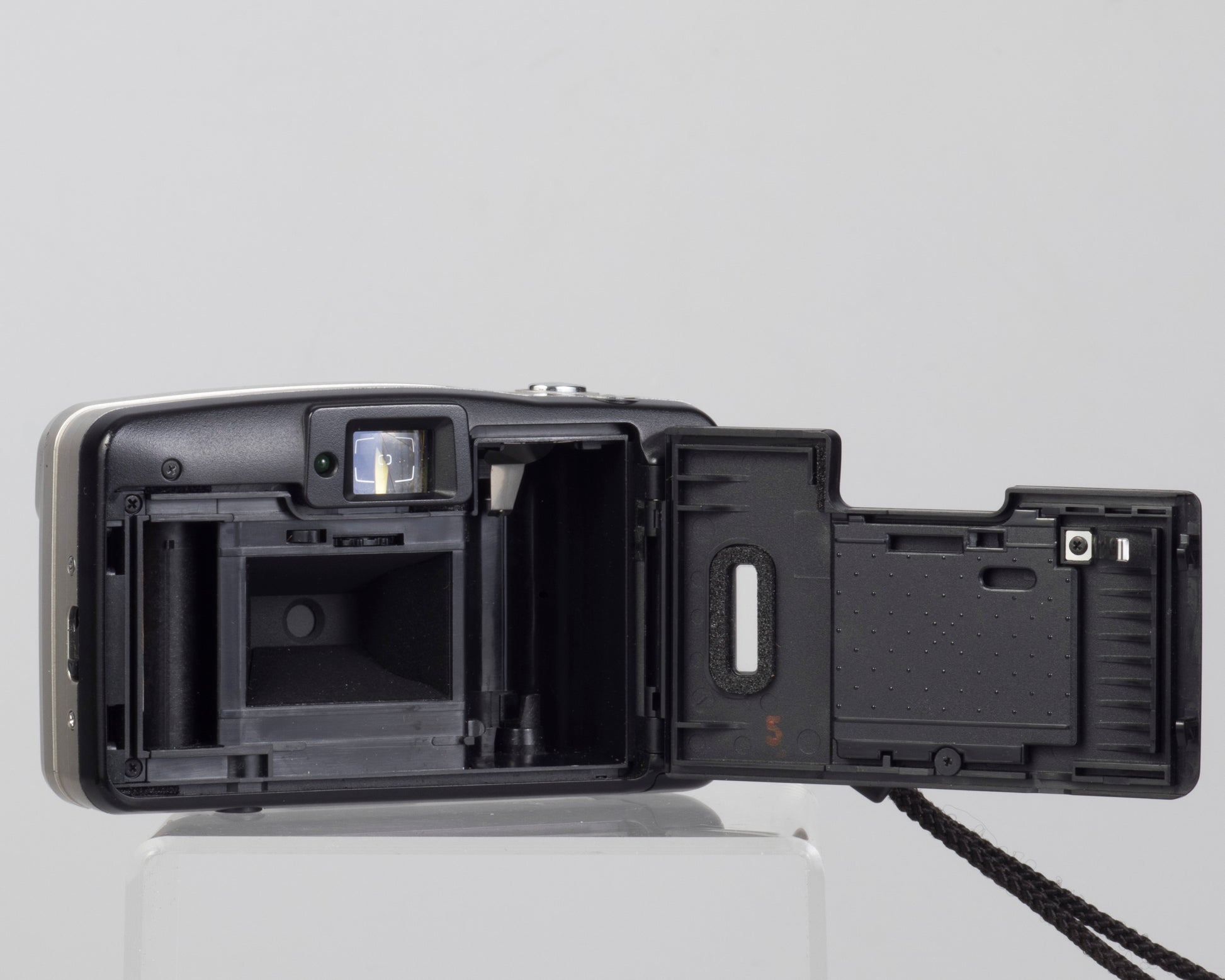 The Minolta AF50 Big Finder is an ultra-compact 35mm film camera from the 1990s (film door open)