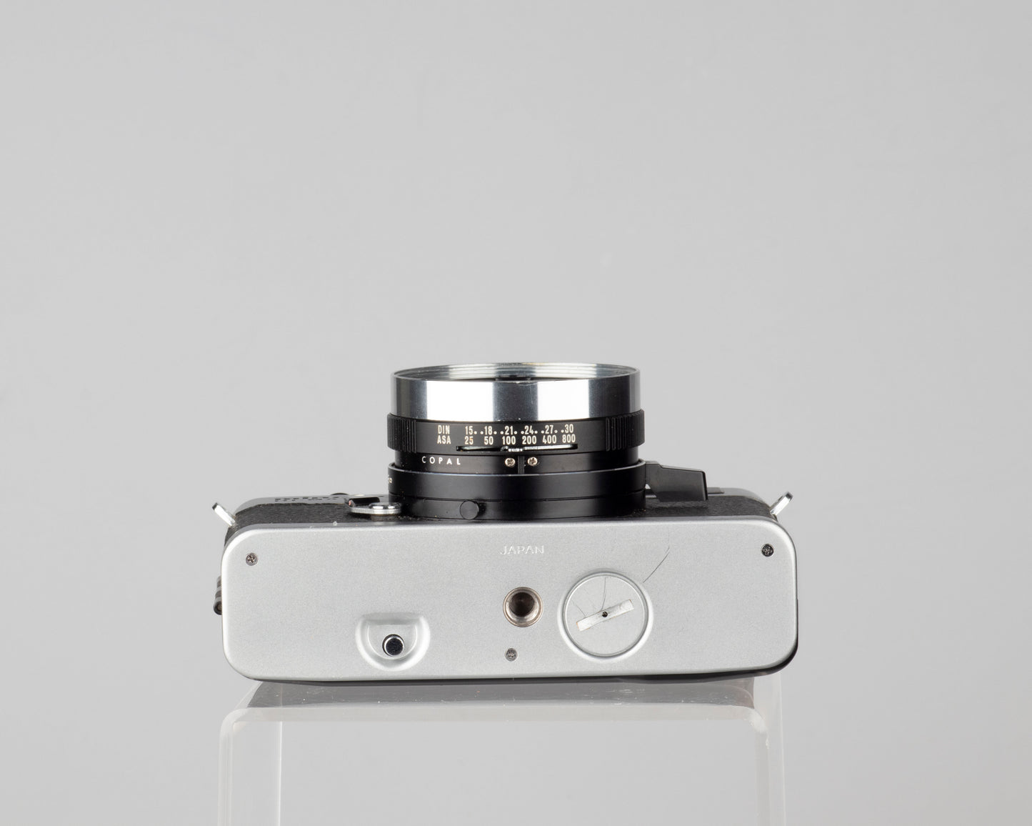 Minolta Hi-Matic 7SII 35mm rangefinder camera with half-case and Minolta 20 flash
