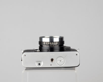 Minolta Hi-Matic 7SII 35mm rangefinder camera with half-case and Minolta 20 flash