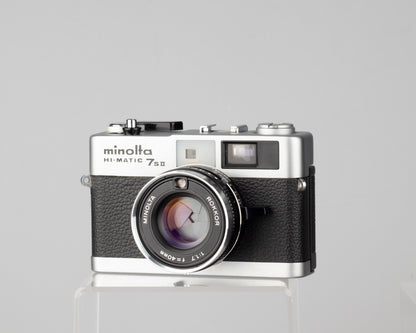 Minolta Hi-Matic 7SII 35mm rangefinder camera with half-case and Minolta 20 flash