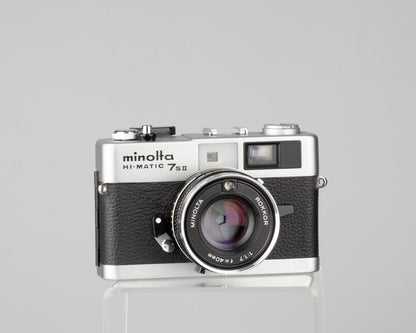 Minolta Hi-Matic 7SII 35mm rangefinder camera with half-case and Minolta 20 flash