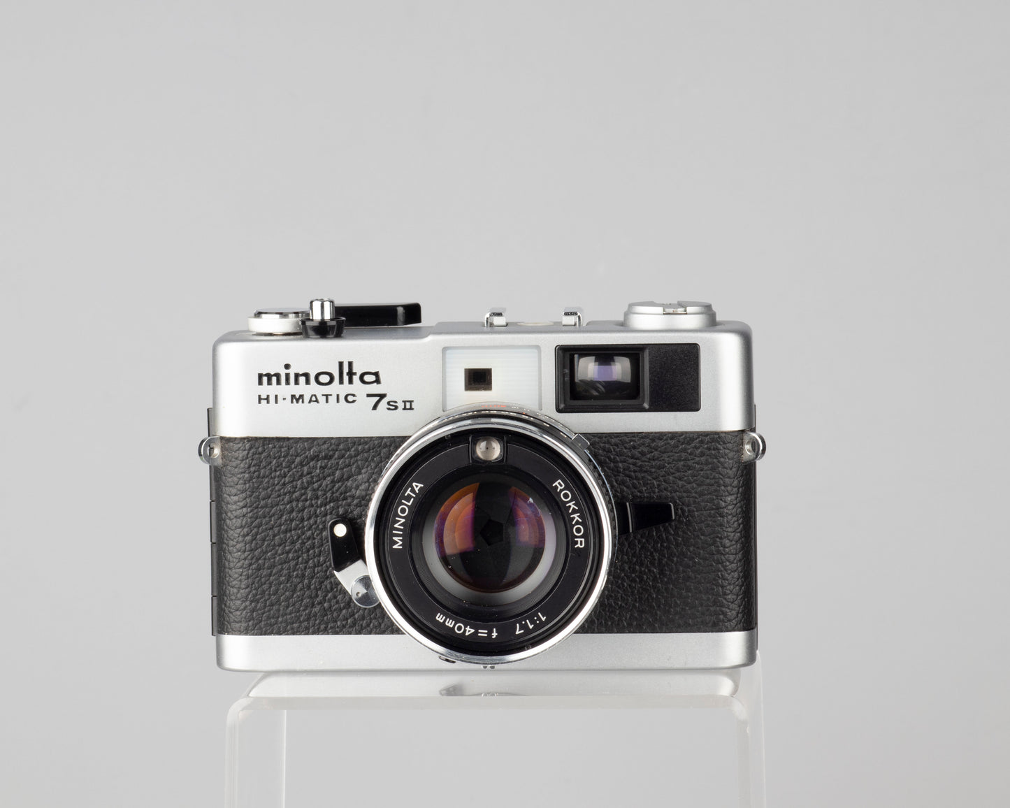 Minolta Hi-Matic 7SII 35mm rangefinder camera with half-case and Minolta 20 flash