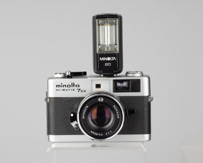 Minolta Hi-Matic 7SII 35mm rangefinder camera with half-case and Minolta 20 flash