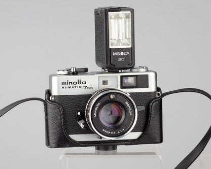 Minolta Hi-Matic 7SII 35mm rangefinder camera with half-case and Minolta 20 flash