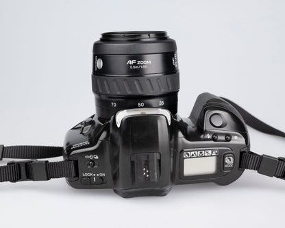 Minolta Maxxum 300si 35mm film SLR avec objectif 35-70mm + manuel