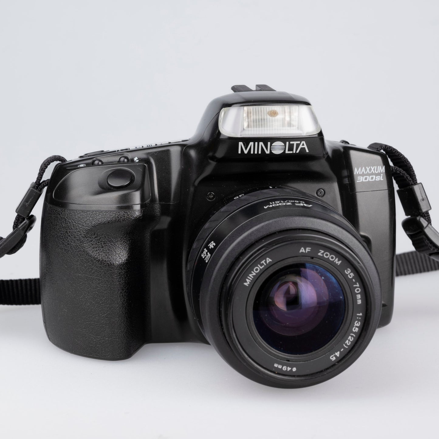 Minolta Maxxum 300si 35mm film SLR avec objectif 35-70mm + manuel