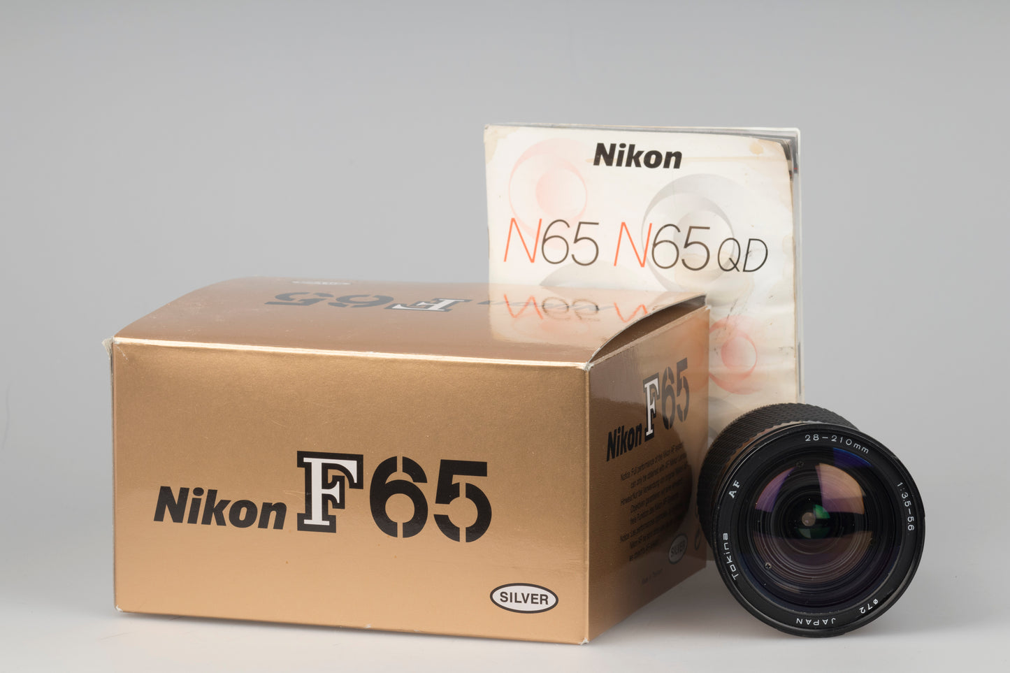 Nikon F65 (alias N65) Reflex 35 mm avec boîte d'origine et manuel + objectif Tokina AF 28-210 mm