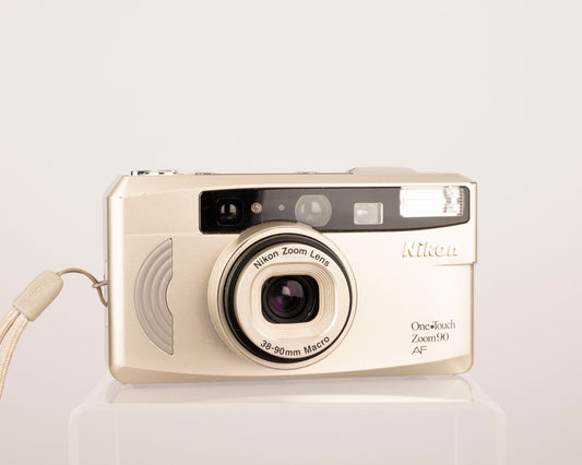 The Nikon One Touch Zoom 90 AF is an elegant and lightweight 35mm point-and-shoot from the turn of the millennium
