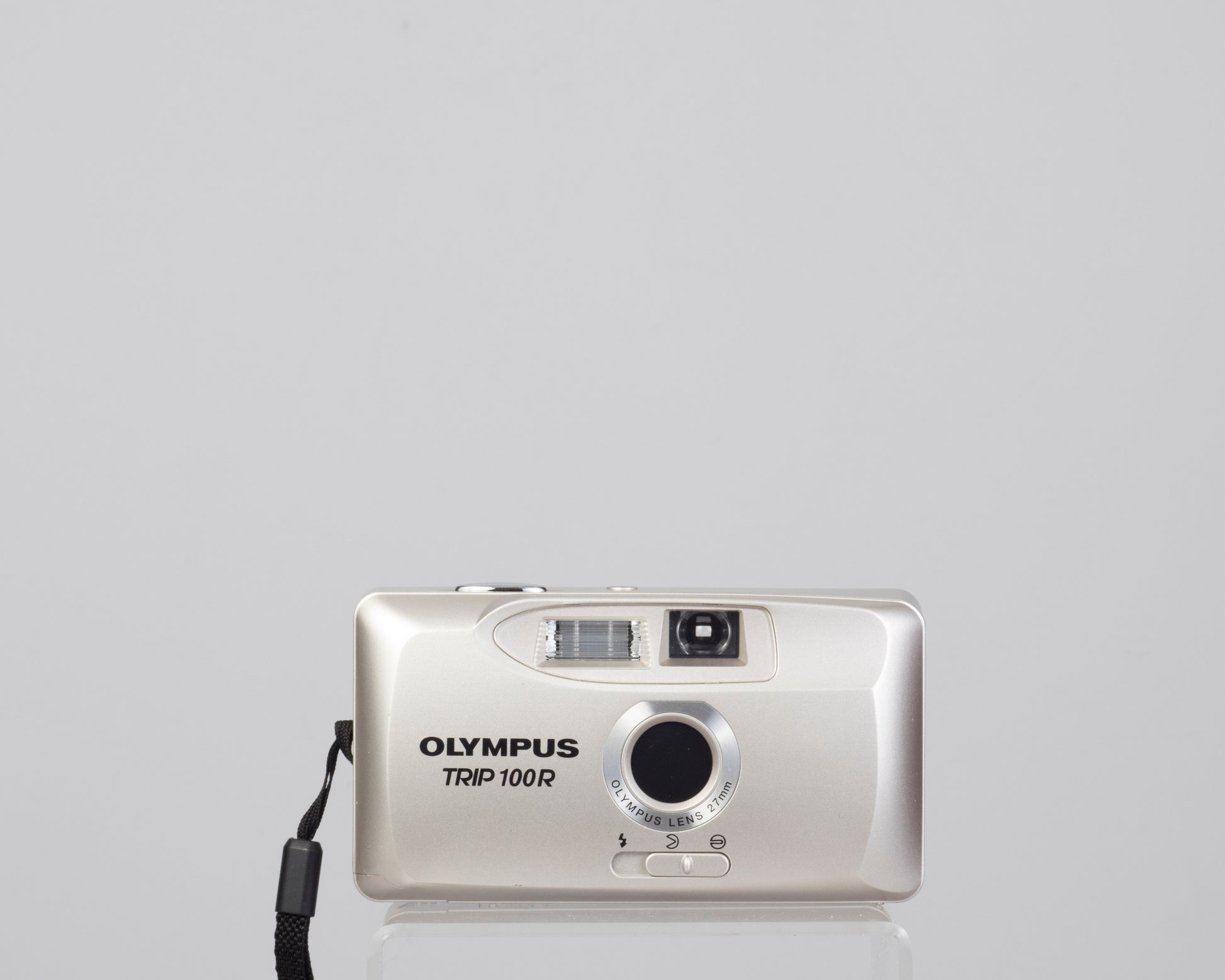 The Olympus Trip 100R compact 35mm camera featuring a wide 27mm lens