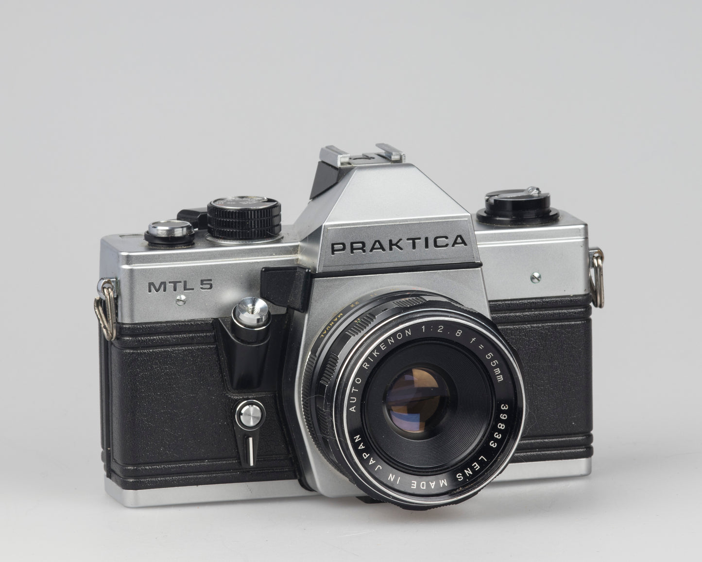 Praktica MTL 5 35mm film SLR camera with Rikenon 55mm f2.8 lens and ever-ready case