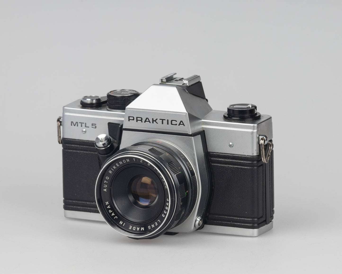 Praktica MTL 5 35mm film SLR camera with Rikenon 55mm f2.8 lens and ever-ready case